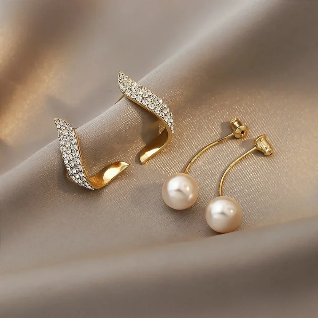 Aretes colgantes elegantes en oro con perlas