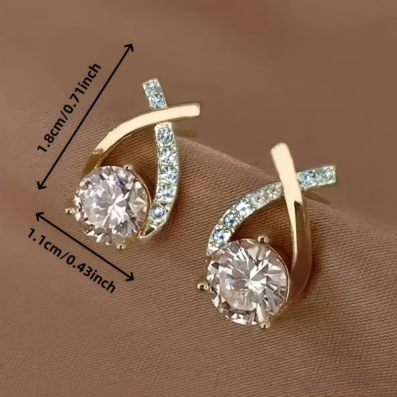 Boucles d’oreilles clous croix dorée en zirconium
