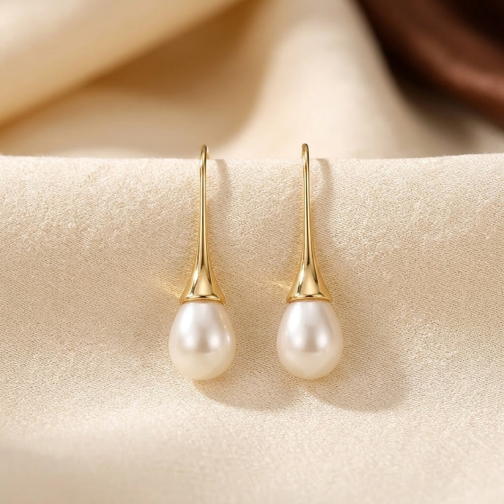 Boucles d'oreilles pendantes en or et perle