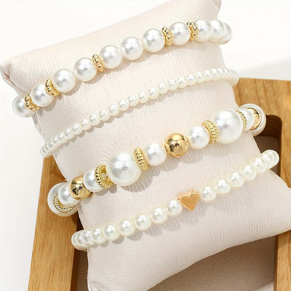 Conjunto de pulseras elegantes con perlas y corazón