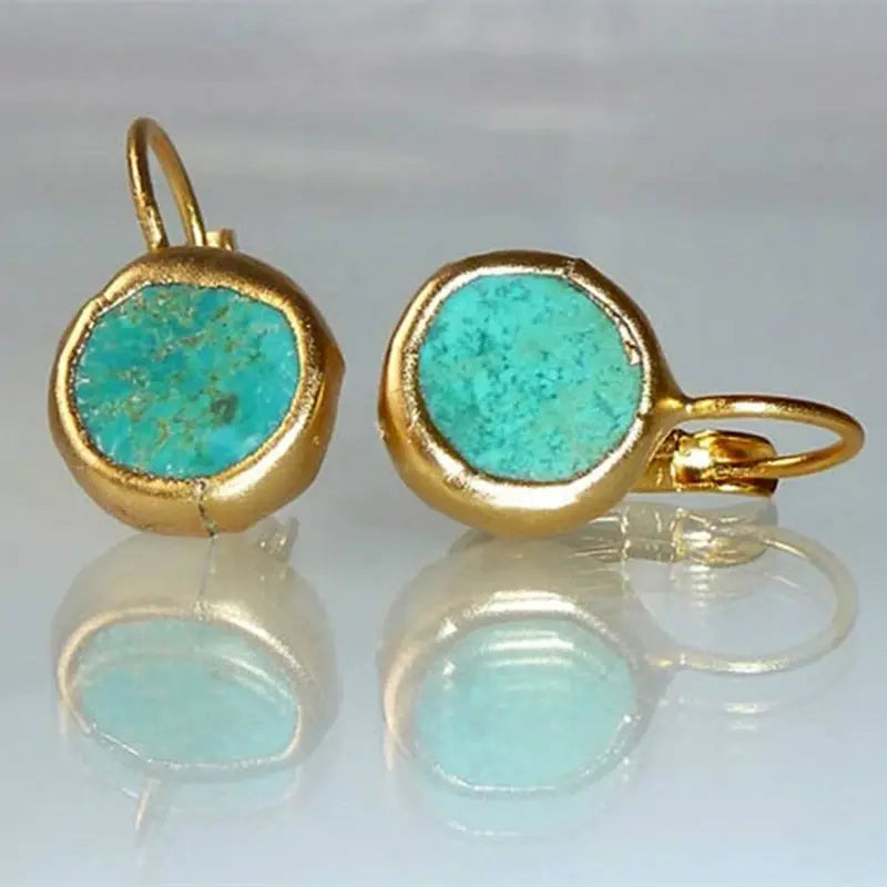 Aretes elegantes dorados con piedra turquesa