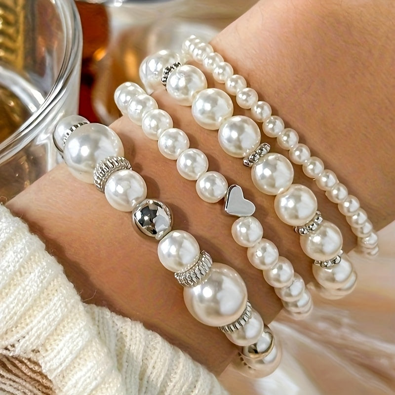 Conjunto de pulseras elegantes con perlas y corazón