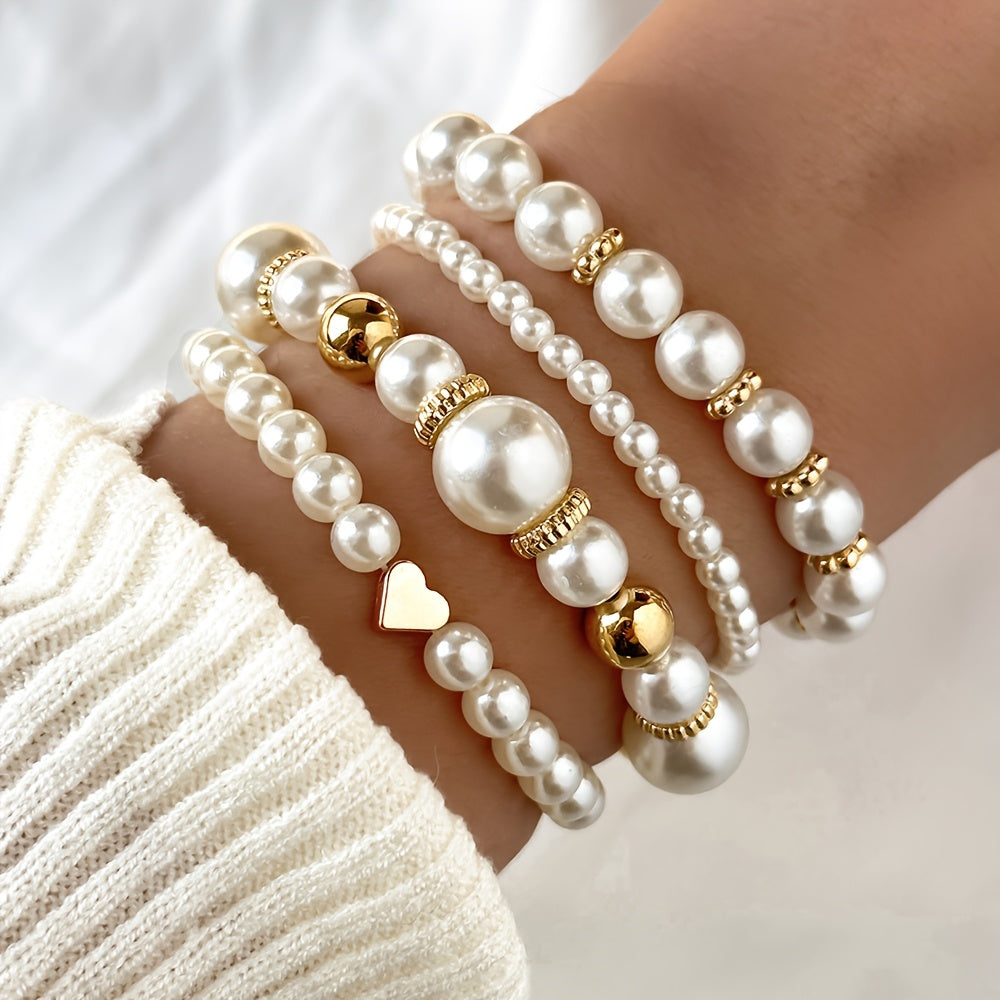 Conjunto de pulseras elegantes con perlas y corazón
