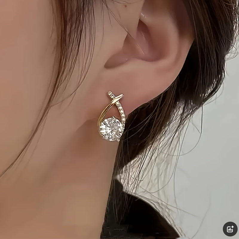 Boucles d’oreilles clous croix dorée en zirconium