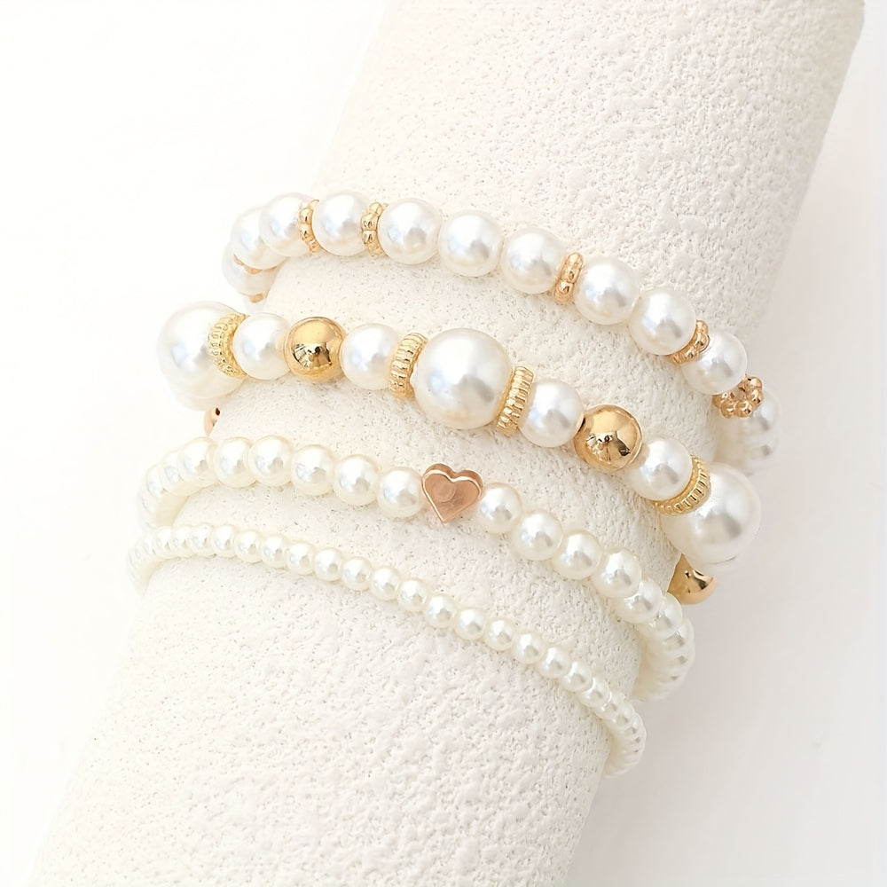Conjunto de pulseras elegantes con perlas y corazón