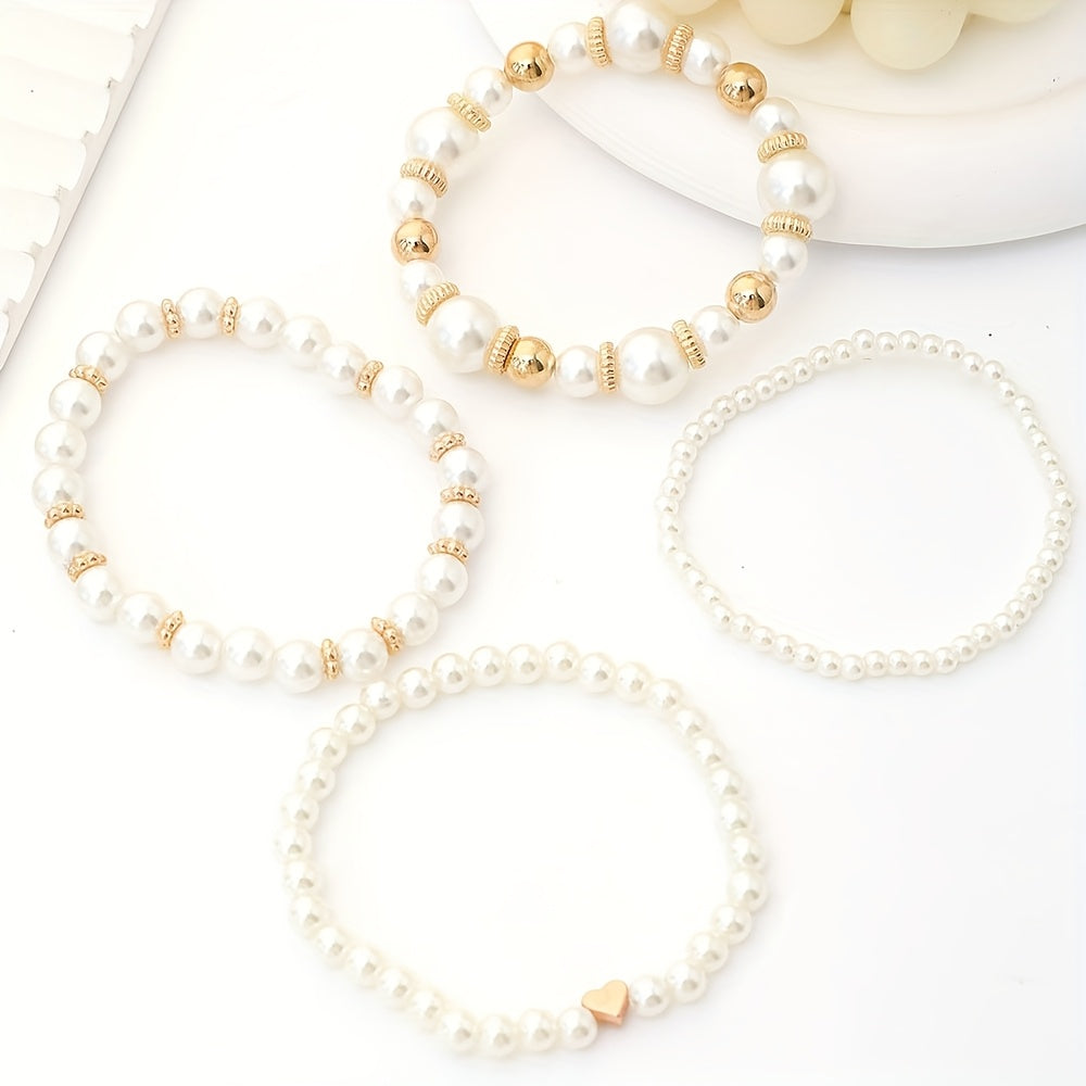 Conjunto de pulseras elegantes con perlas y corazón