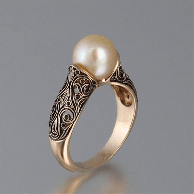 Anillo de oro filigranado con perla