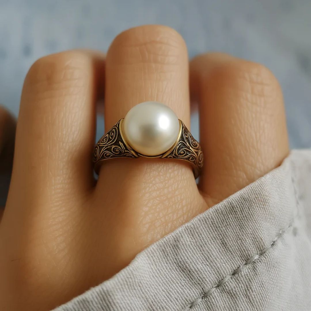 Anillo de oro filigranado con perla